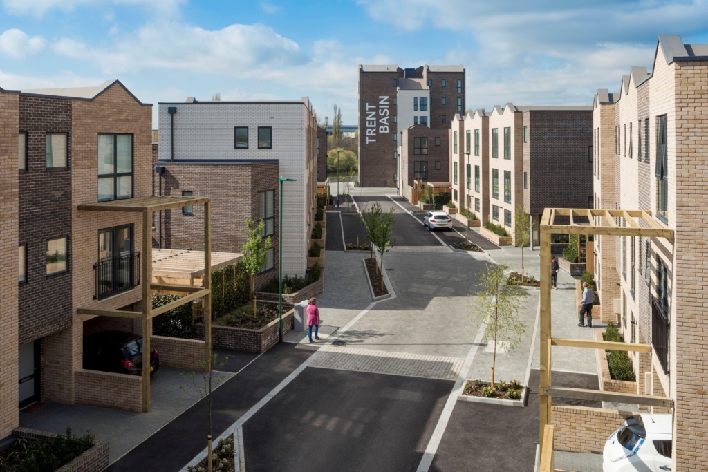 Trent Basin from up high, showin gpeople in the street and housing all around, with pedestrian friendly roads and paths 