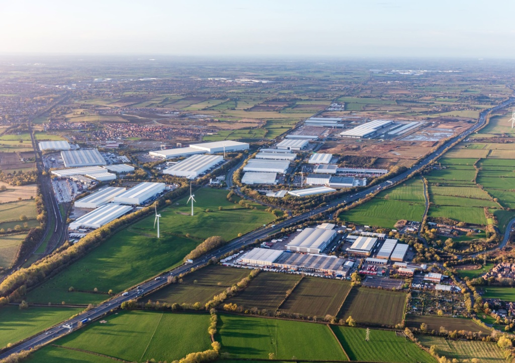 Aerial photo of Daventry, showing the immense scale of the development, alongside the M1 road and green fields surrounding